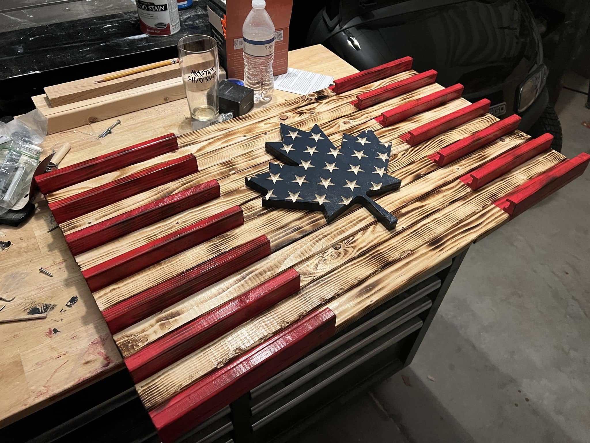 Coin rack with Canadian and American flags, close left