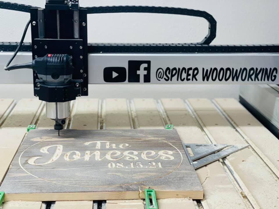CNC machine cutting wood in the shop